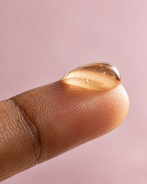 C-Glow 15 Serum texture on a fingertip